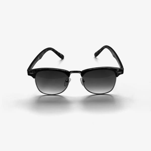 The uploaded product photo of a pair of black browline sunglasses, front on against a plain pale ground.